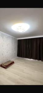 a room with a bed with a curtain and a light at Panoramic view in Tamga