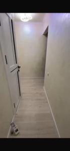 an empty room with a door and a hallway at Panoramic view in Tamga +2 photos