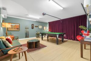 a living room with a pool table in it at 21 Forever in Pokolbin