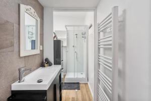 a bathroom with a white sink and a shower at Le Loft 11 Draguignan in Draguignan +14 photos