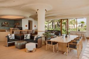 a dining room with a table and chairs at Miraval The Red Sea All Inclusive Adults Only in Ḩanak