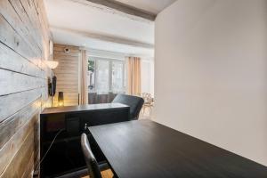 a dining room with a wooden table and chairs at Le Loft 11 Draguignan in Draguignan