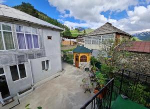an overhead view of a house with a balcony at Family hotel ucha in Iprari