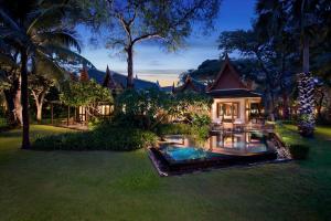 a house with a swimming pool in the yard at Hyatt Regency Hua Hin in Hua Hin