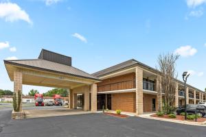 a building with a parking lot in front of it at Quality Inn Kinston Hwy 70 in Kinston