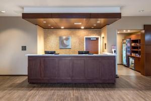 a lobby of a hospital with a reception counter at Comfort Suites Midland West in Midland +52 photos