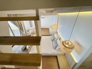 a view of a living room with wooden stairs at Tonsak Resort in Ko Samed