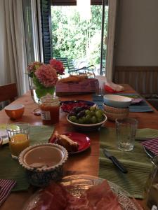 a table with plates of food on top of it at Charming House In Herrliberg in Herrliberg +2 photos