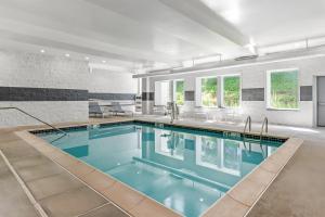 an indoor swimming pool in a house at Spark By Hilton Hershey Near The Park in Hershey
