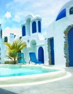 a house with blue chairs next to a swimming pool at La Casa del Sol in Kandy +28 photos