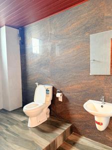 a bathroom with a toilet and a sink at Bravon Sky Hotel in Kurunegala +20 photos