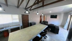 a large room with a large table and chairs at Wave Dancer 2-Bedroom Apartment in St Lucia