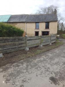 a wooden fence in front of a house at house in Saint-André-des-Eaux
