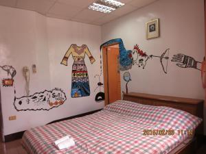Postel nebo postele na pokoji v ubytování 太魯閣蘇西小空間 SusiSpace