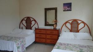 Кровать или кровати в номере Villa Cupatitzio
