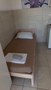 a bunk bed in a small room with a towel at Studio Apartment Sanja 2 in Neum