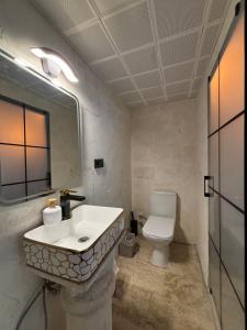 a bathroom with a sink and a toilet at Kasri Reyyan in Mardin +72 photos