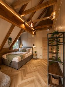 a bedroom with a bed in a attic at Book-A-Room Salzburg Garden or Balcony Stay - 2 bedroom - air conditioning & free parking in Salzburg