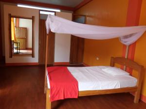 Postel nebo postele na pokoji v ubytování Tambopata Hostel