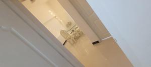a door leading into a room with a chair at White Cloud Stay Attappadi in Agali +23 photos