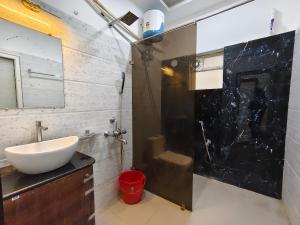 a bathroom with a sink and a mirror at Sea Wander Beach Resort in Mandarmoni +28 photos