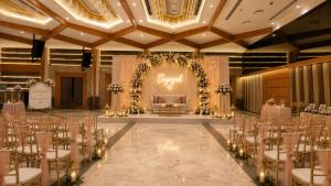 a banquet hall with chairs and a couch in the middle at Estrella The Resort in Karjat