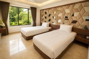 a bedroom with two beds and a large window at Estrella The Resort in Karjat +53 photos