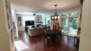 a living room with a table and a couch at Evergreen House in Vancouver