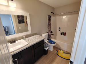 a bathroom with a sink and a toilet and a mirror at Evergreen House in Vancouver +138 photos