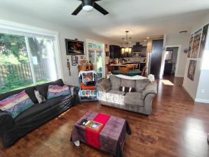 a living room with a couch and a table at Evergreen House in Vancouver