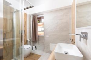 a bathroom with a sink and a shower at Comfyrooms in Quartu SantʼElena
