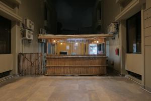 an empty room with a stage in a building at Xefan Hotels in Karachi