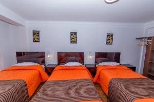 Postel nebo postele na pokoji v ubytování Hotel Peru Real