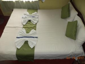 Postel nebo postele na pokoji v ubytování Raja174 Homestay