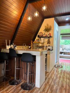 a kitchen with a island in the middle of a room at Casa Carmelita in Batangas City