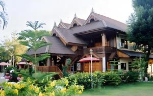 a large house with a gambrel roof at Oopkaew Resort in Pua +67 photos