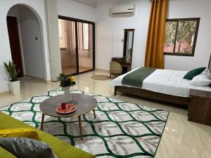 a bedroom with a bed and a table in a room at Waterfront vip master room in Muscat