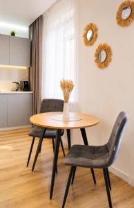 a table and chairs in a living room at ЖК "Женис III" in Kokshetau