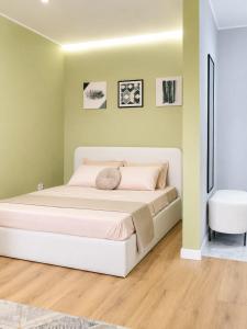 a bedroom with a large white bed in a room at ЖК "Женис III" in Kokshetau