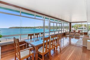 a dining room with a view of the ocean at The Oriana in Sydney