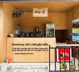 a restaurant with a counter with a sign on it at Đảo Ngọc Retreat in Quang Ninh