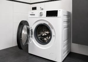 a white washer and dryer in a room at Ferienhaus Schieferland in Müllenbach