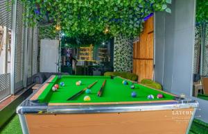 a pool table with balls on it in a room at Laycon hotel and suites in Ikuata