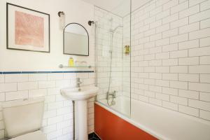 a bathroom with a sink and a toilet and a shower at The Rodney Hotel in Bristol +26 photos