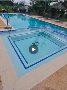 a swimming pool in a resort with a swimming pool at Maria Francisca Hometead 