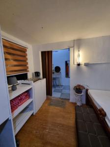 a room with a kitchen with a stove and a counter at Maria Francisca Hometead 