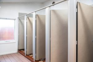a row of lockers in a room with a window at Geelong Holiday Park in Geelong