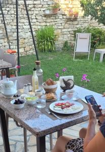 a table with food on top of it at Villa Starova in Berat