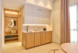 a kitchen with a sink and a counter top at Ocean Drive Málaga - New Opening 2026 in Málaga