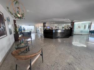a lobby with chairs and tables in a building at Turbo Club in Maspalomas +46 photos
